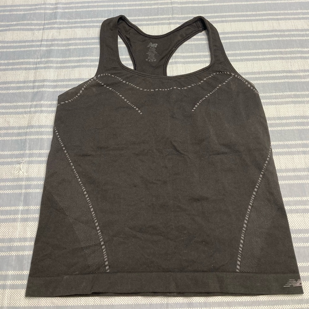 New Balance black athletic top with gray details.